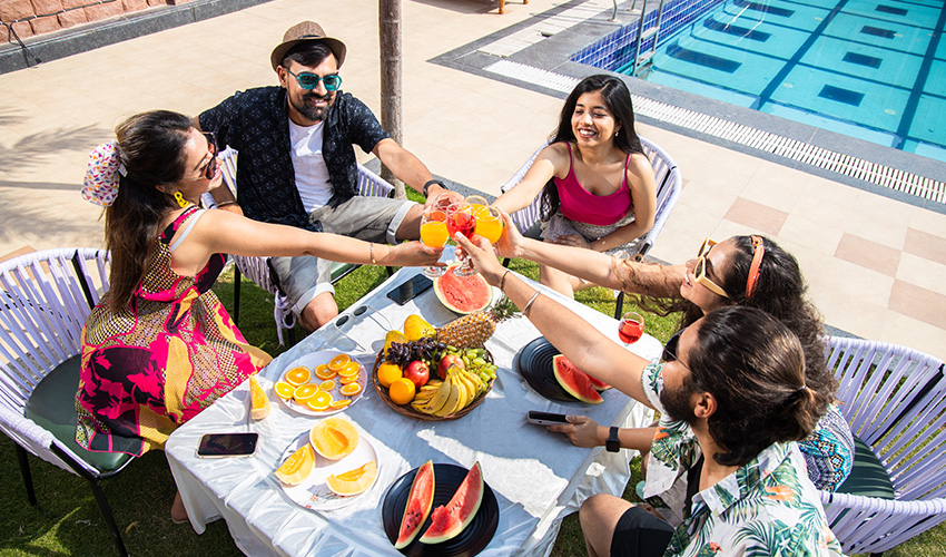 A group of young people on vacation enjoying healthy meal