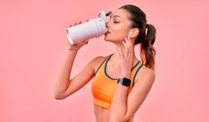 A young female having a protein health drink post work out